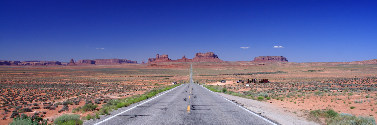 A long road stretches into the distance.